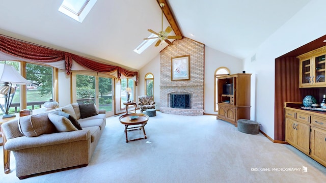 1420 Greenlake Dr, Aurora, IL 60502 - living room with a skylight, a ceiling fan, high vaulted ceiling, beam ceiling, and a fireplace