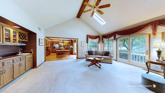 1420 Greenlake Dr, Aurora, IL 60502 - living room with bar with sink, high vaulted ceiling, light carpet, beam ceiling, and ceiling fan