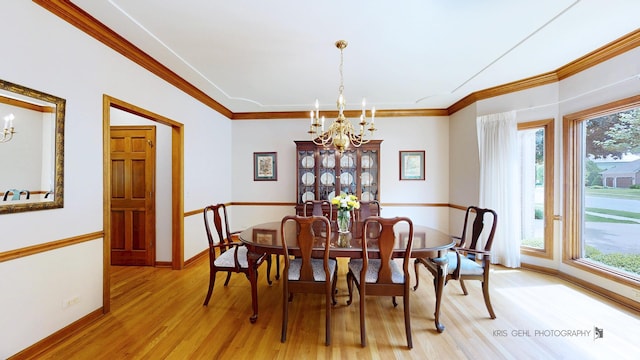 1420 Greenlake Dr, Aurora, IL 60502 - dining area with a chandelier, light wood finished floors, and ornamental molding