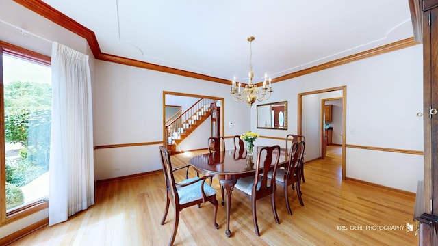 1420 Greenlake Dr, Aurora, IL 60502 - dining space featuring a chandelier, light wood-style flooring, ornamental molding, and stairway