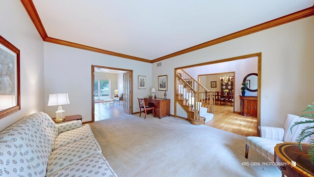 1420 Greenlake Dr, Aurora, IL 60502 - carpeted living area featuring a chandelier, crown molding, and stairs