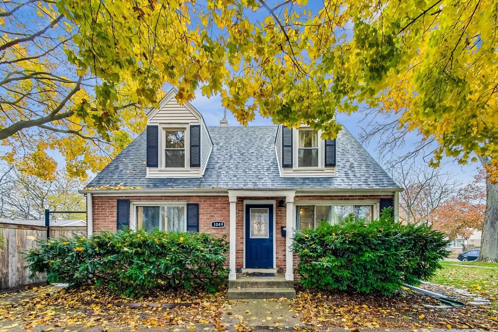 1049 Fowler Ave, Evanston, IL 60202 - view of front facade featuring brick siding and a shingled roof