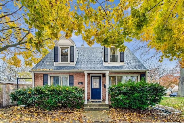 1049 Fowler Ave, Evanston, IL 60202 - view of front facade featuring brick siding and a shingled roof