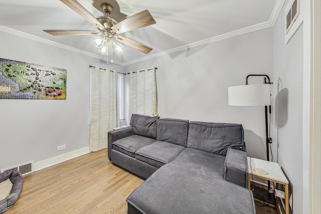 1049 Fowler Ave, Evanston, IL 60202 - living room featuring ornamental molding, wood finished floors, a ceiling fan, and baseboards