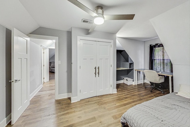 1049 Fowler Ave, Evanston, IL 60202 - bedroom with wood finished floors, baseboards, lofted ceiling, a ceiling fan, and a closet