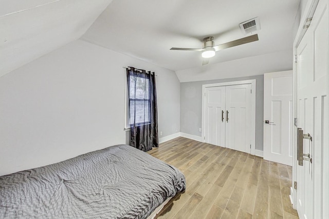 1049 Fowler Ave, Evanston, IL 60202 - bedroom with light wood finished floors, lofted ceiling, a closet, ceiling fan, and baseboards