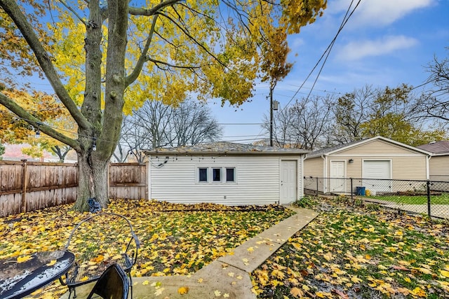 1049 Fowler Ave, Evanston, IL 60202 - rear view of property featuring a fenced backyard and an outdoor structure