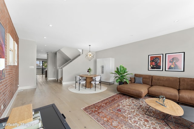 3406 N Keating Ave, Chicago, IL 60641 - living room featuring light wood-style floors, recessed lighting, and a chandelier