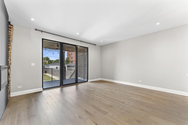 3406 N Keating Ave, Chicago, IL 60641 - spare room with wood finished floors and recessed lighting
