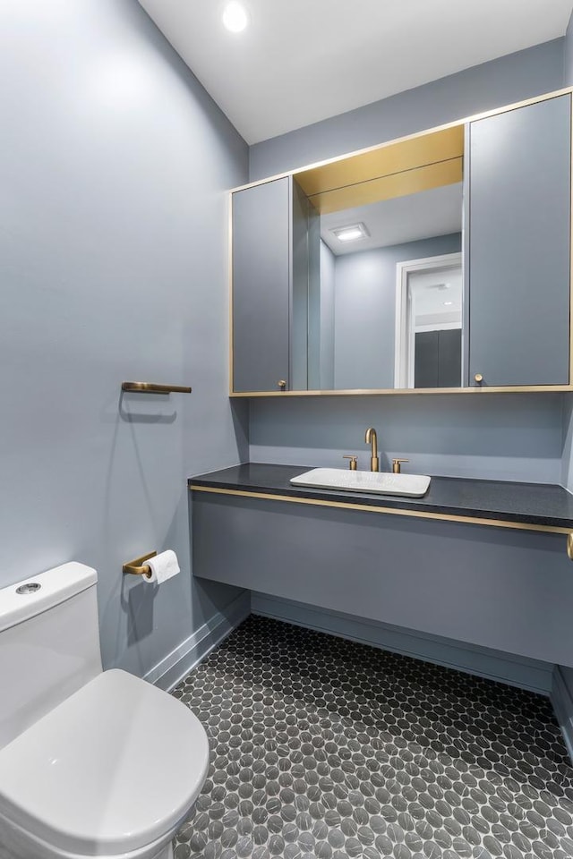 3406 N Keating Ave, Chicago, IL 60641 - bathroom featuring baseboards and vanity