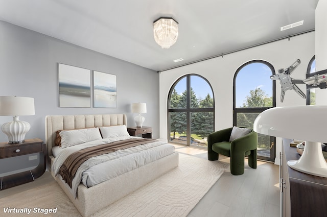 3406 N Keating Ave, Chicago, IL 60641 - bedroom featuring a chandelier and wood finished floors