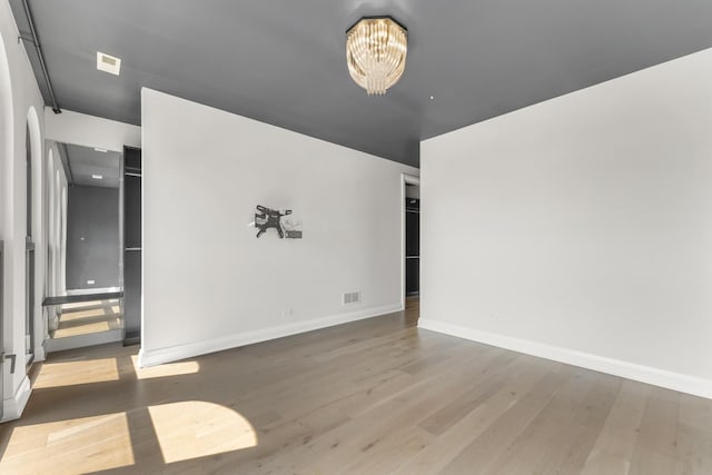3406 N Keating Ave, Chicago, IL 60641 - spare room with wood finished floors and a chandelier