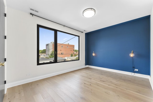3406 N Keating Ave, Chicago, IL 60641 - spare room featuring wood finished floors and baseboards