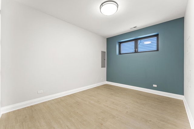 3406 N Keating Ave, Chicago, IL 60641 - empty room featuring electric panel and wood finished floors