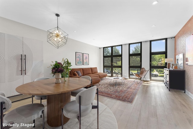 3406 N Keating Ave, Chicago, IL 60641 - dining area featuring light wood-style flooring, plenty of natural light, expansive windows, and recessed lighting