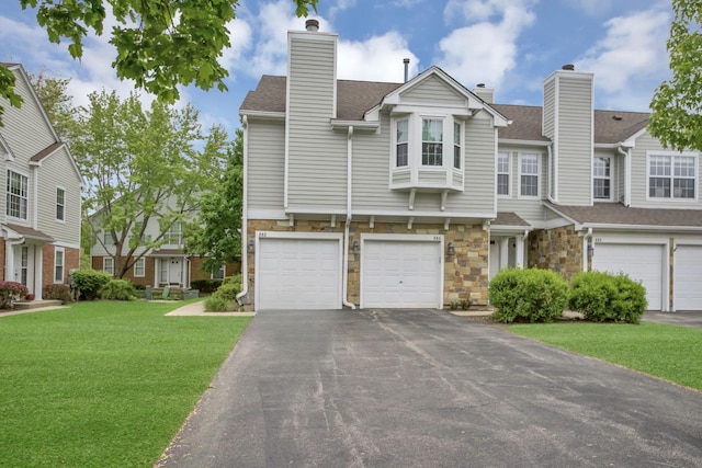 886 Ann Arbor Ln, Vernon Hills, IL 60061 - view of property with driveway, a garage, and stone siding
