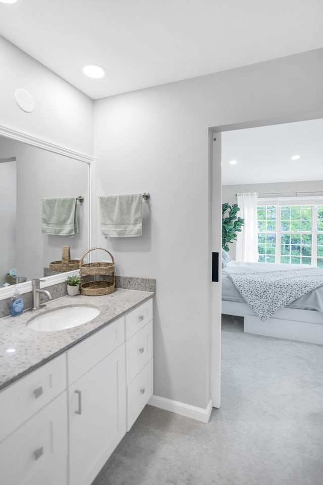 886 Ann Arbor Ln, Vernon Hills, IL 60061 - bathroom featuring vanity, ensuite bath, baseboards, and recessed lighting