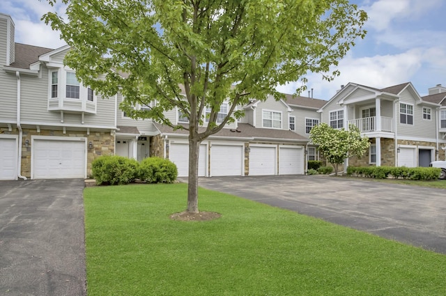 886 Ann Arbor Ln, Vernon Hills, IL 60061 - multi unit property featuring stone siding, a front lawn, a garage, and driveway