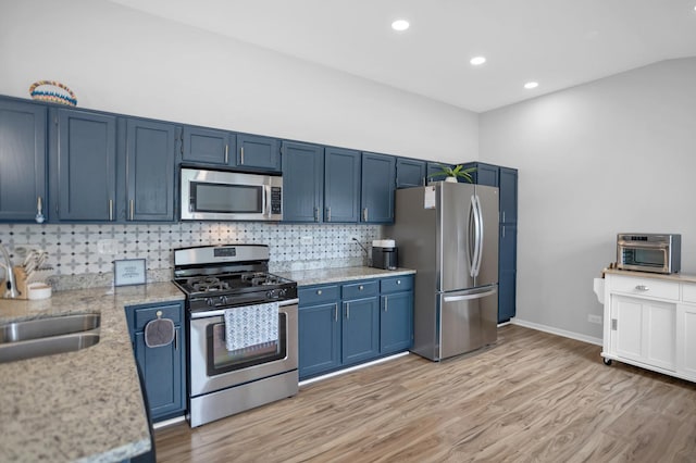 886 Ann Arbor Ln, Vernon Hills, IL 60061 - kitchen featuring appliances with stainless steel finishes, blue cabinetry, light wood finished floors, and recessed lighting