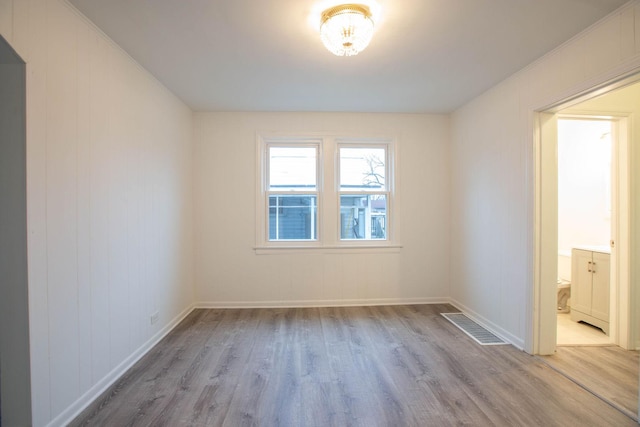 9237 S Utica Ave, Evergreen Park, IL 60805 - spare room with wood finished floors and baseboards