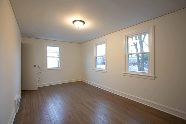 9237 S Utica Ave, Evergreen Park, IL 60805 - spare room featuring dark wood-style floors and baseboards