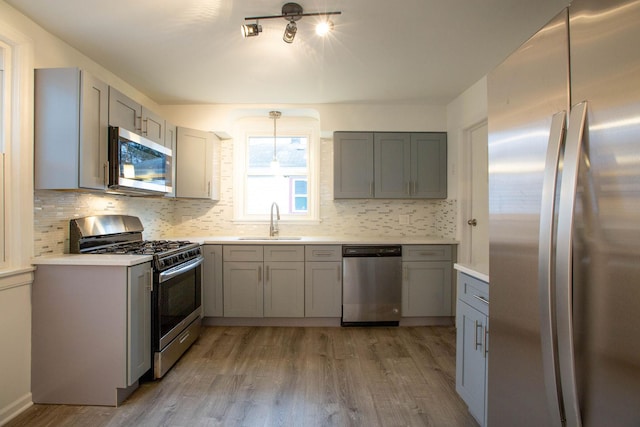 9237 S Utica Ave, Evergreen Park, IL 60805 - kitchen with stainless steel appliances, gray cabinets, wood finished floors, and a sink