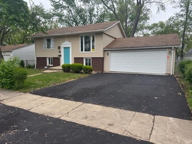 4237 Arlington Dr, Richton Park, IL 60471 - raised ranch with driveway and an attached garage