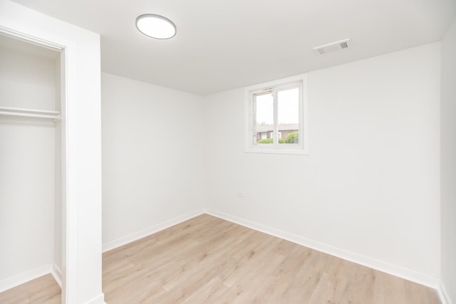4237 Arlington Dr, Richton Park, IL 60471 - unfurnished bedroom with light wood finished floors, baseboards, and a closet