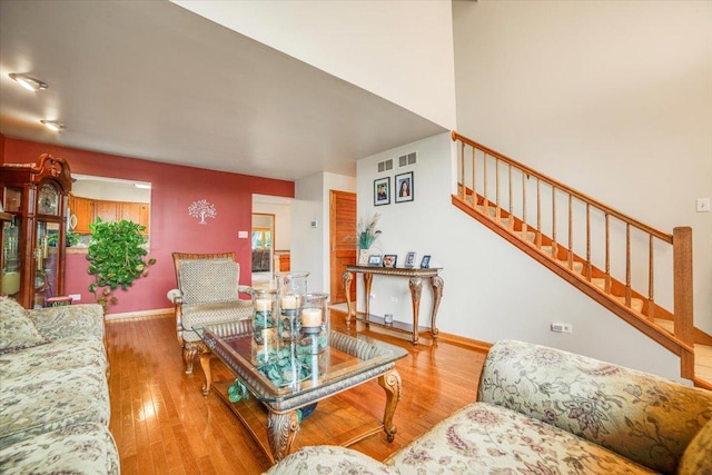 16308 S Peerless Ct, Plainfield, IL 60586 - living room featuring stairs, wood finished floors, and baseboards