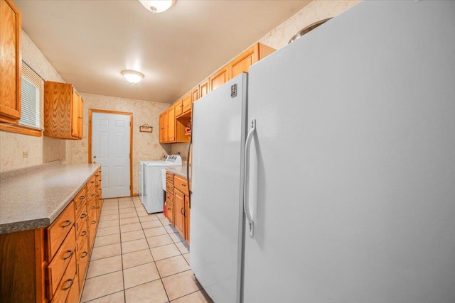 16308 S Peerless Ct, Plainfield, IL 60586 - kitchen featuring separate washer and dryer, freestanding refrigerator, and light tile patterned floors