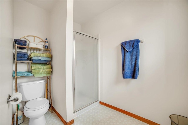 16308 S Peerless Ct, Plainfield, IL 60586 - bathroom with tile patterned floors, a shower stall, baseboards, and toilet