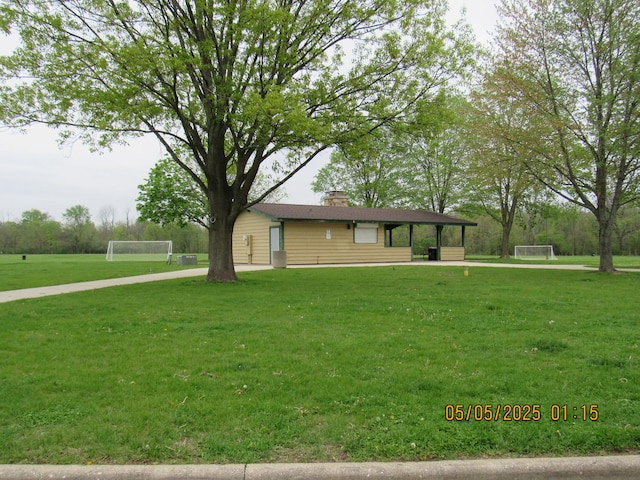 16308 S Peerless Ct, Plainfield, IL 60586 - view of front of home featuring an area for soccer and a chimney