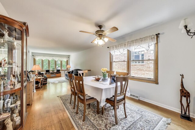 5560 W Ardmore Ave, Chicago, IL 60646 - dining space featuring ceiling fan, light wood-style floors, and baseboards