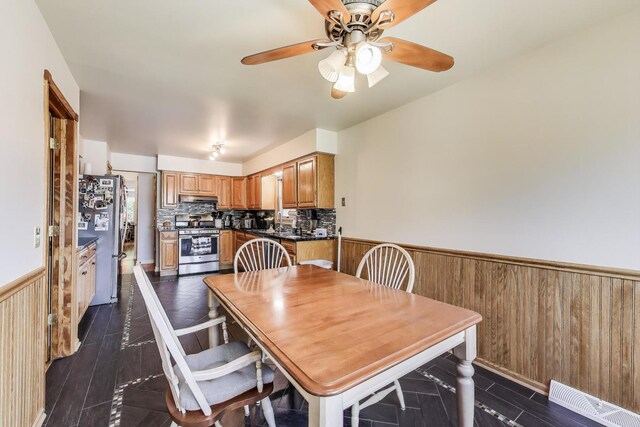 5560 W Ardmore Ave, Chicago, IL 60646 - dining space featuring a wainscoted wall and ceiling fan