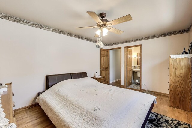 5560 W Ardmore Ave, Chicago, IL 60646 - bedroom featuring baseboards, wood finished floors, a ceiling fan, and ensuite bath