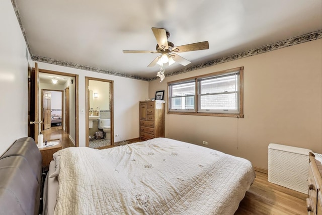 5560 W Ardmore Ave, Chicago, IL 60646 - bedroom featuring wood finished floors, baseboards, ensuite bathroom, and a ceiling fan