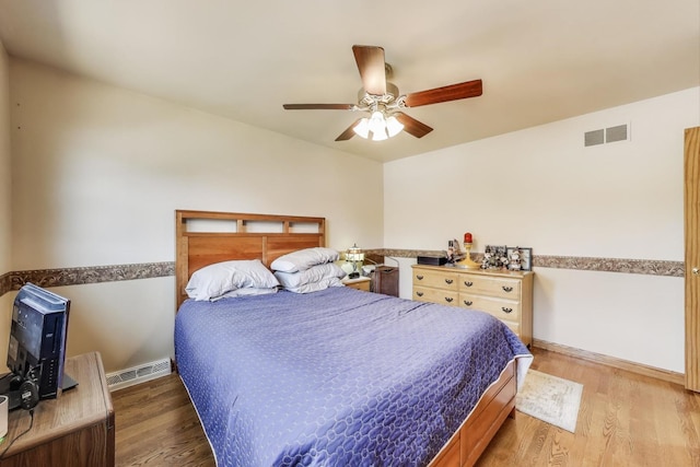 5560 W Ardmore Ave, Chicago, IL 60646 - bedroom with wood finished floors, ceiling fan, and baseboards
