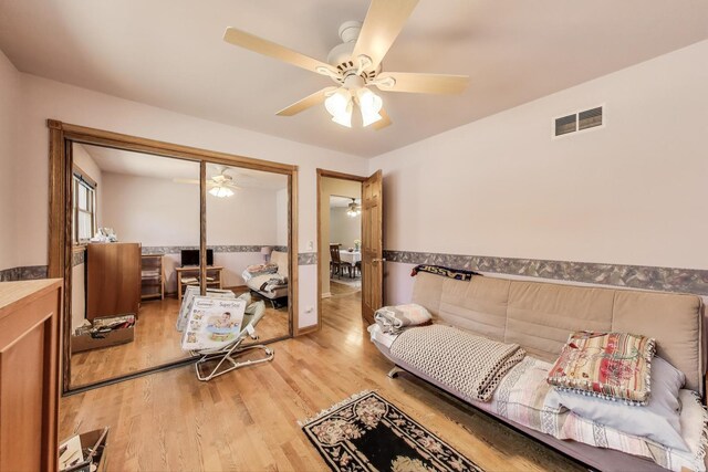 5560 W Ardmore Ave, Chicago, IL 60646 - living room featuring ceiling fan and light wood-type flooring