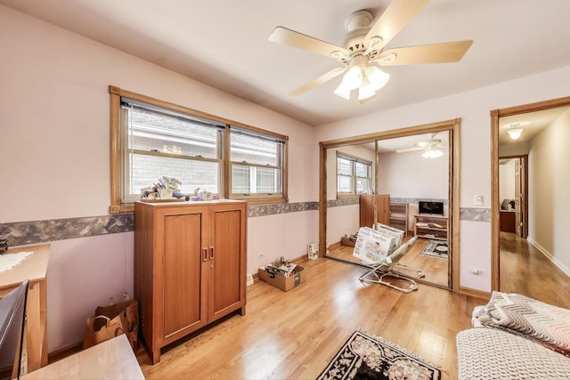 5560 W Ardmore Ave, Chicago, IL 60646 - interior space with a ceiling fan, light wood finished floors, and baseboards