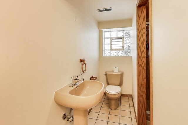 5560 W Ardmore Ave, Chicago, IL 60646 - bathroom with toilet and tile patterned floors