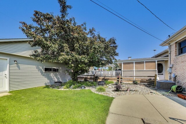 5560 W Ardmore Ave, Chicago, IL 60646 - view of green lawn featuring central air condition unit