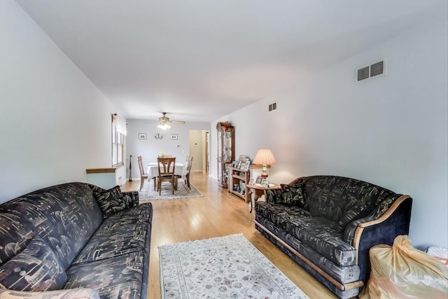 5560 W Ardmore Ave, Chicago, IL 60646 - living room featuring a ceiling fan and light wood-type flooring