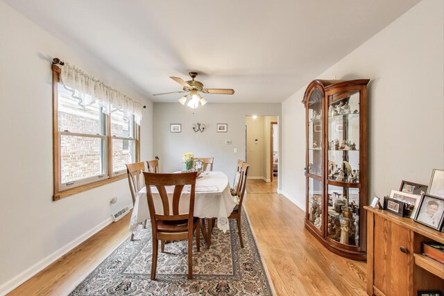 5560 W Ardmore Ave, Chicago, IL 60646 - dining room featuring light wood-style flooring, a ceiling fan, and baseboards