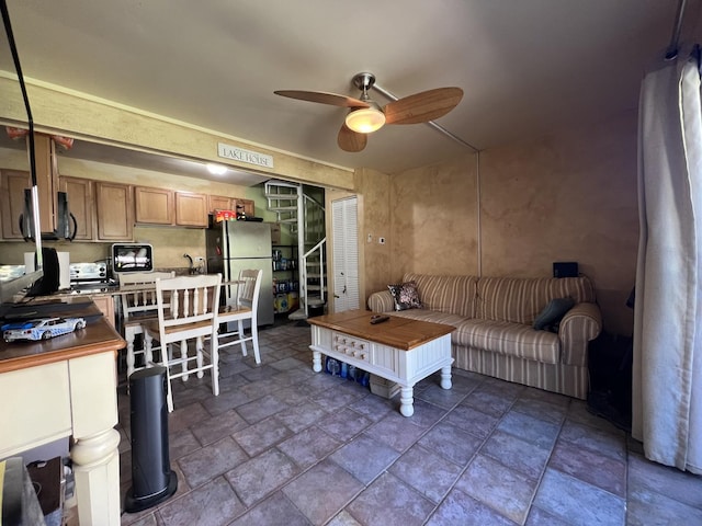 57 Vail Colony Unit 7, Fox Lake, IL 60020 - living area featuring stone tile floors and ceiling fan