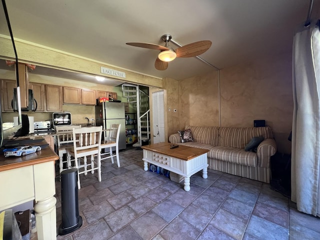 57 Vail Colony Unit 7, Fox Lake, IL 60020 - living area with ceiling fan, stone tile flooring, and stairs