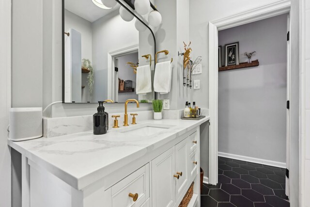 2149 N Seminary Ave Unit A, Chicago, IL 60614 - bathroom featuring vanity, tile patterned flooring, and baseboards