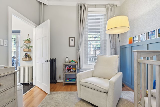 2149 N Seminary Ave Unit A, Chicago, IL 60614 - bedroom with radiator, wood finished floors, multiple windows, and crown molding