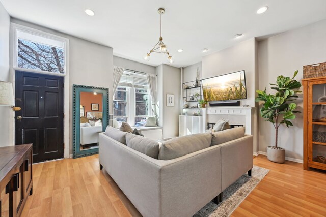 2149 N Seminary Ave Unit A, Chicago, IL 60614 - living area featuring light wood-style floors, recessed lighting, a fireplace, and baseboards