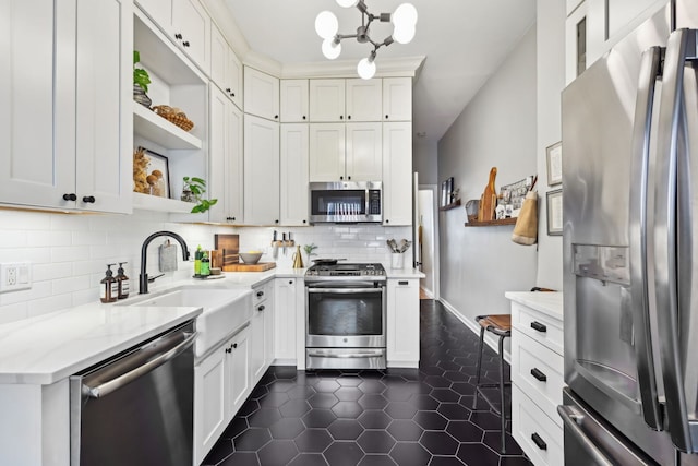 2149 N Seminary Ave Unit A, Chicago, IL 60614 - kitchen featuring appliances with stainless steel finishes, open shelves, dark tile patterned flooring, backsplash, and a sink
