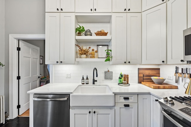 2149 N Seminary Ave Unit A, Chicago, IL 60614 - kitchen with stainless steel appliances, a sink, and tasteful backsplash